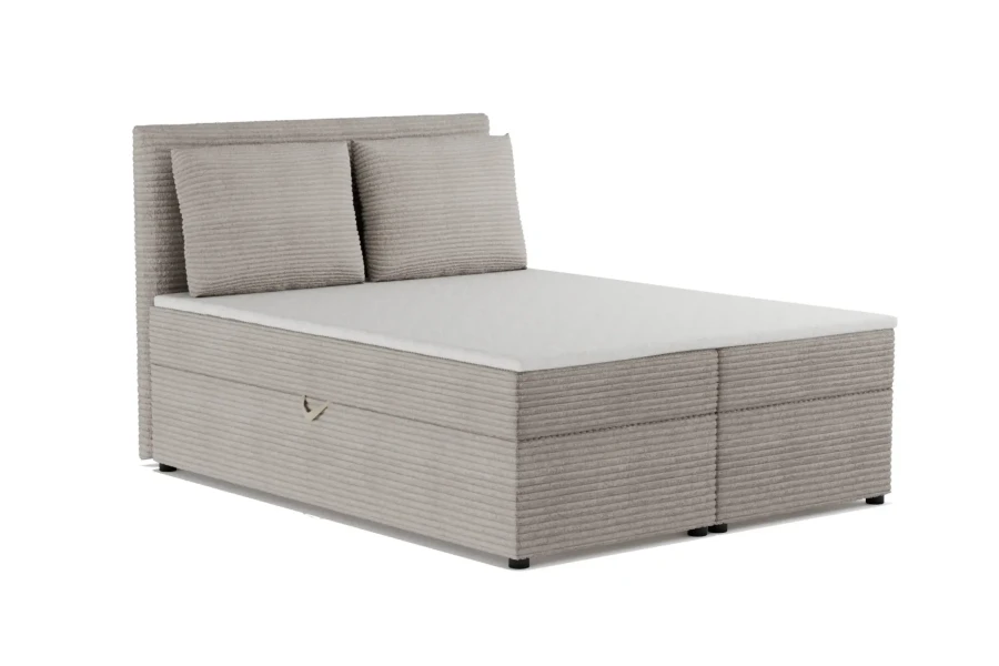 Graues Boxspringbett aus Cord mit Bettkasten und zwei Kissen