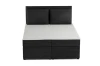 Frontansicht eines schwarzen Cord-Boxspringbettes mit zwei Kissen.