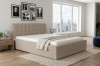 Modernes Polsterbett mit Cord-Bezug in Beige im Schlafzimmer mit Panoramablick auf die Stadt.