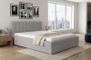 Graues Polsterbett mit Cord-Struktur im modernen Schlafzimmer mit Stadtblick.