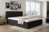 Modernes Schlafzimmer-Design mit schwarzem Polsterbett in Cord-Optik und City-View.