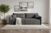 Modernes dunkelgraues Sofa im stilvollen Wohnzimmer mit Teppich und Wandbildern.