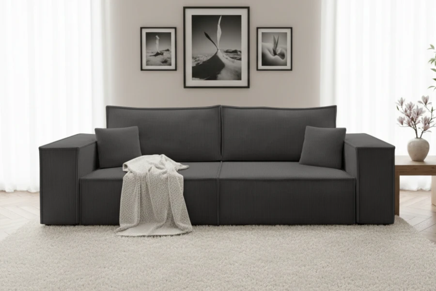 Modernes Sofa in Anthrazit mit Cord-Bezug im stilvollen Wohnzimmer Ambiente.