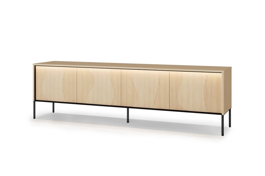 Geschlossenes FAVOS Lowboard mit gewellter Frontoptik und integrierter LED-Beleuchtung.