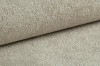 Detailaufnahme von hochwertigem Bouclé-Stoff in Beige für moderne Polstermöbel.