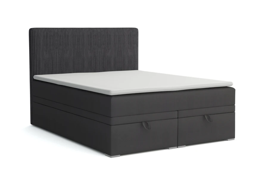 Dunkelgraues Boxspringbett mit integriertem Bettkasten und Topper.
