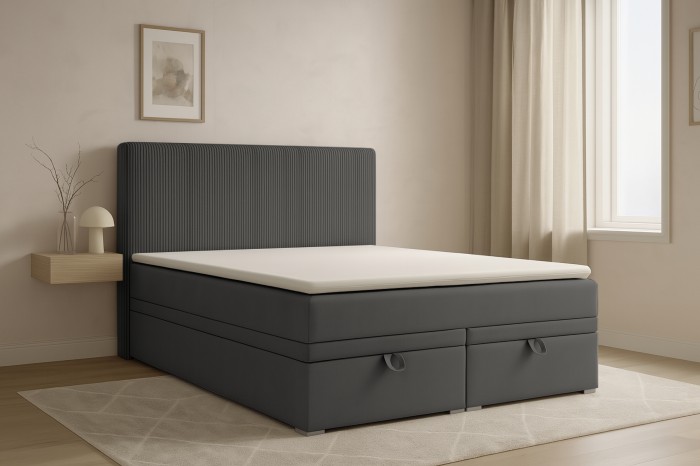 Gemütliches Schlafzimmer-Ambiente mit anthrazitfarbenem Boxspringbett.