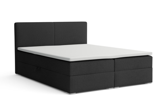 Modernes Boxspringbett in Anthrazit mit weißem Topper auf weißem Hintergrund.