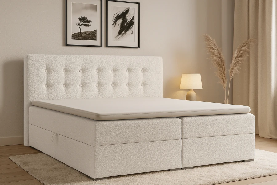 Komfortables weißes Boxspringbett mit gestepptem Kopfteil und Topper in modernem Design.