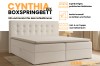 Cynthia Lux Boxspringbett mit Bettkasten und Kaltschaum-Topper in hellem Bouclé-Stoff für das Schlafzimmer.
