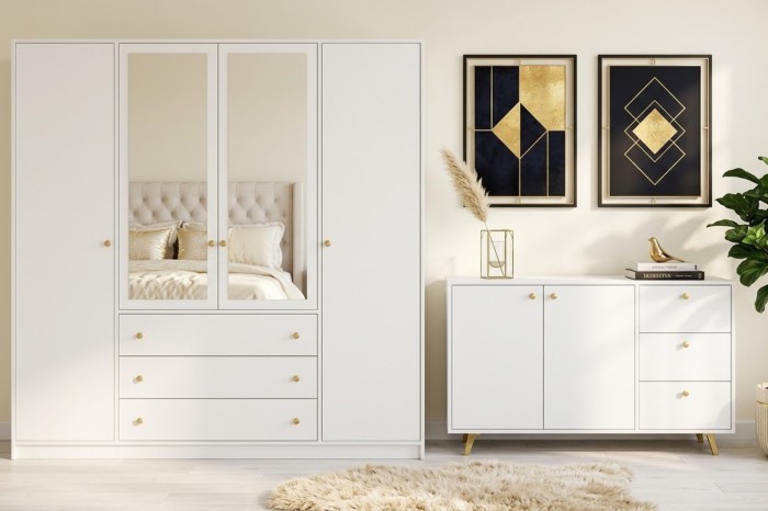 Helles Schlafzimmer-Set in Weiß mit Schrank, Kommode und goldenen Akzenten.