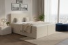 Modernes Boxspringbett in Beige mit Cord-Bezug im hellen Schlafzimmer mit Stadtblick.