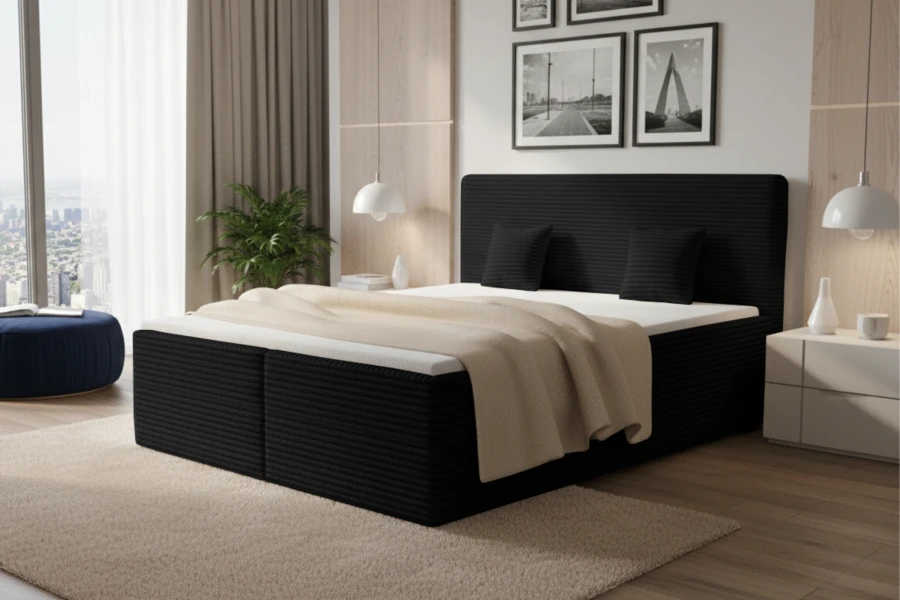 Stilvolles schwarzes Boxspringbett mit strukturierter Oberfläche für ein modernes Ambiente.