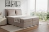 Elegantes Boxspringbett in Taupe mit Cord-Stoff und gemütlicher Bettwäsche.
