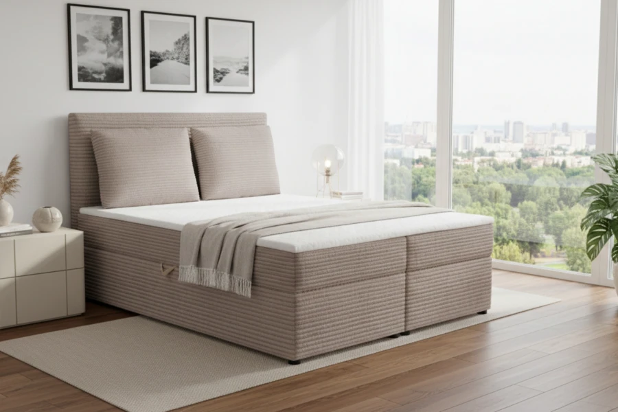 Elegantes Boxspringbett in Taupe mit Cord-Stoff und gemütlicher Bettwäsche.