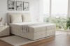 Modernes Boxspringbett in Beige mit Cord-Bezug im hellen Schlafzimmer.