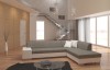 Modernes Ecksofa in Grau und Weiß in einem hellen Wohnzimmer mit Treppe