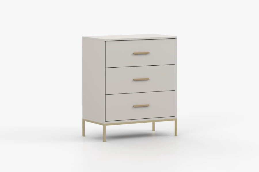 Beige Kommode mit drei Schubladen sowie goldenen Griffen und Füßen.