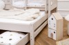 Ausziehbares Gästebett für das Kinderzimmer mit dekorativem Spielzeughaus aus Holz.