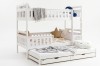 Modern white bunk bed with additional guest bed on a white background.