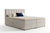 Beiges Boxspringbett mit Cord-Bezug, hohem Kopfteil und praktischem Bettkasten.