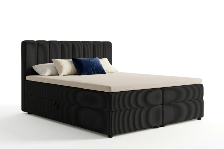 Modernes schwarzes Boxspringbett mit Cord-Bezug und Bettkasten auf weißem Grund.