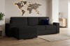 Dunkelgraues L-Sofa im Wohnzimmer mit beleuchteter Holz-Weltkarte und hellem Teppich.