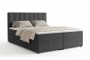 Modernes Boxspringbett in Anthrazit mit vertikal gestepptem Kopfteil.