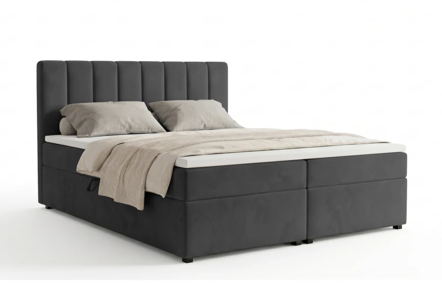Modernes Boxspringbett in Anthrazit mit vertikal gestepptem Kopfteil.