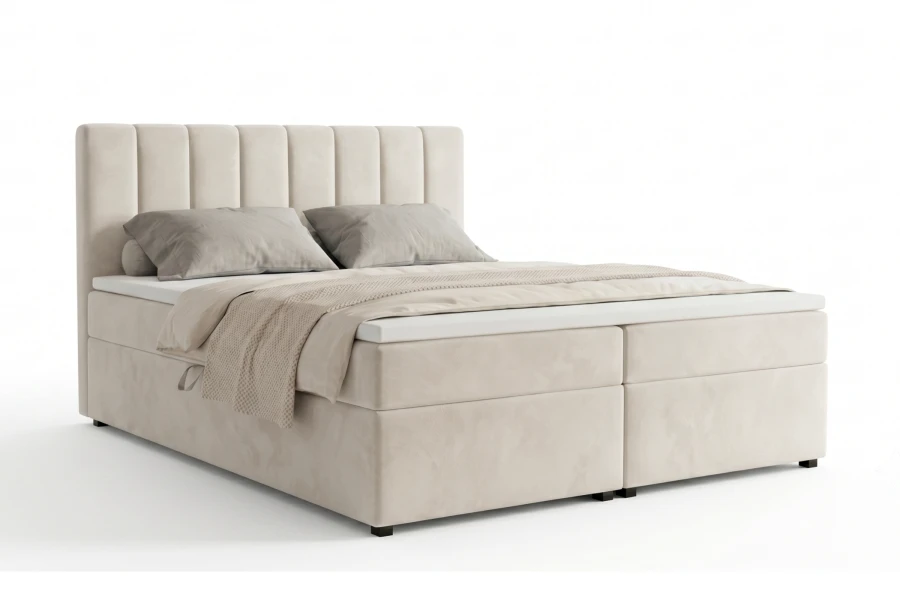 Boxspringbett in hellem Beige mit gepolstertem Kopfteil.