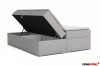 Graues Polsterbett mit geöffnetem Bettkasten für viel Stauraum.