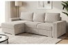 Modernes Ecksofa in Creme mit Cord-Bezug und Ottomane links im Wohnzimmer.