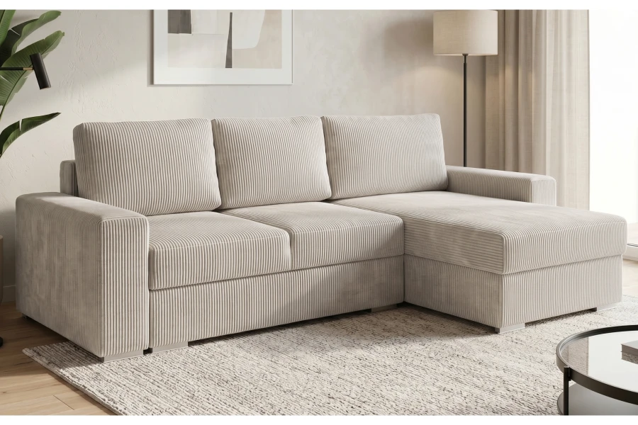 Cremefarbenes Cord-Ecksofa mit Ottomane rechts für ein modernes Ambiente.