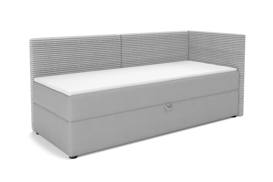 Hellgraues Boxspring-Schlafsofa mit Cord-Optik und Bettkasten, Seitenansicht.