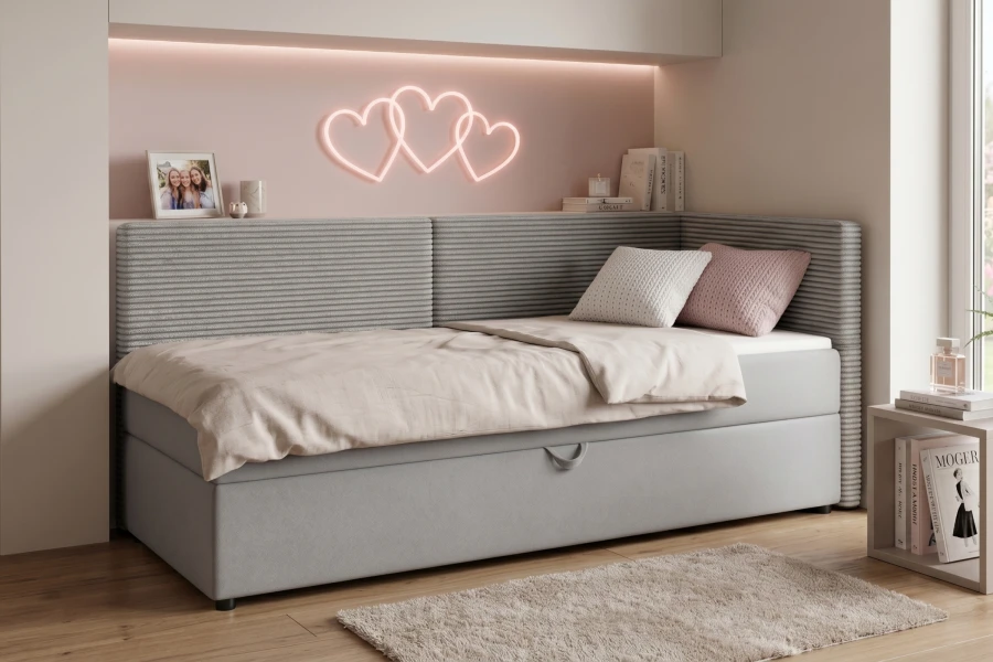 Gemütliches Schlafsofa in Hellgrau mit Cord-Details im hellen Kinderzimmer.