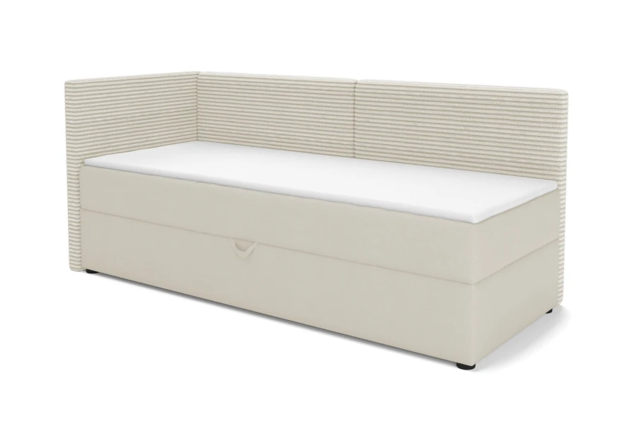 Cremefarbenes Boxspringbett mit geripptem Kopfteil, Ausführung Links.