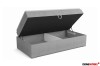 Graues Boxspringbett mit offenem Bettkasten für viel Stauraum.
