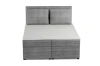 Vorderansicht eines Boxspringbettes in Grau mit strukturiertem Cord-Stoff und Kissen.