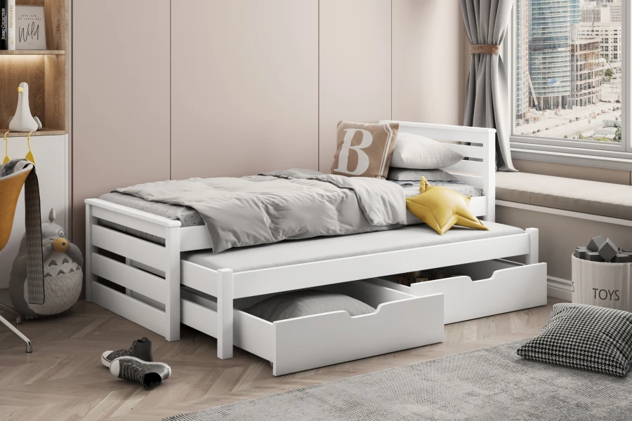 Vollständig weißes Kinder-Ausziehbett mit praktischem Stauraum für Spielzeug.