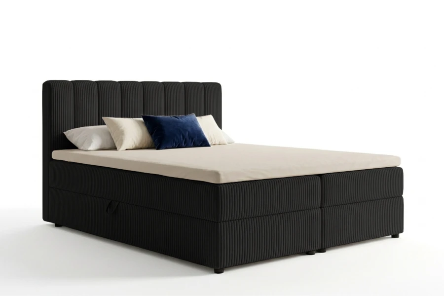 Schwarzes Boxspringbett mit Cord-Bezug und hohem Kopfteil vor weißem Hintergrund.