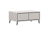 Moderner beige Couchtisch mit zwei Schubladen und schwarzen Beinen.