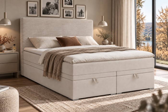 Beiges Boxspringbett mit Stauraum und hohem Kopfteil sorgt für eine helle Schlafzimmer-Optik.