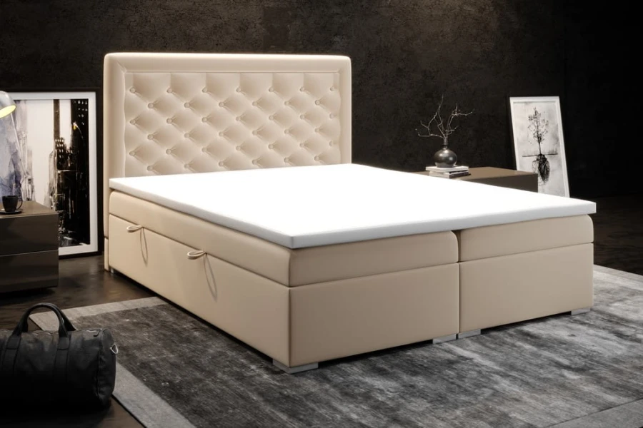 Stilvolles beiges Polsterbett im modern gestalteten Schlafzimmer mit Bettkasten.