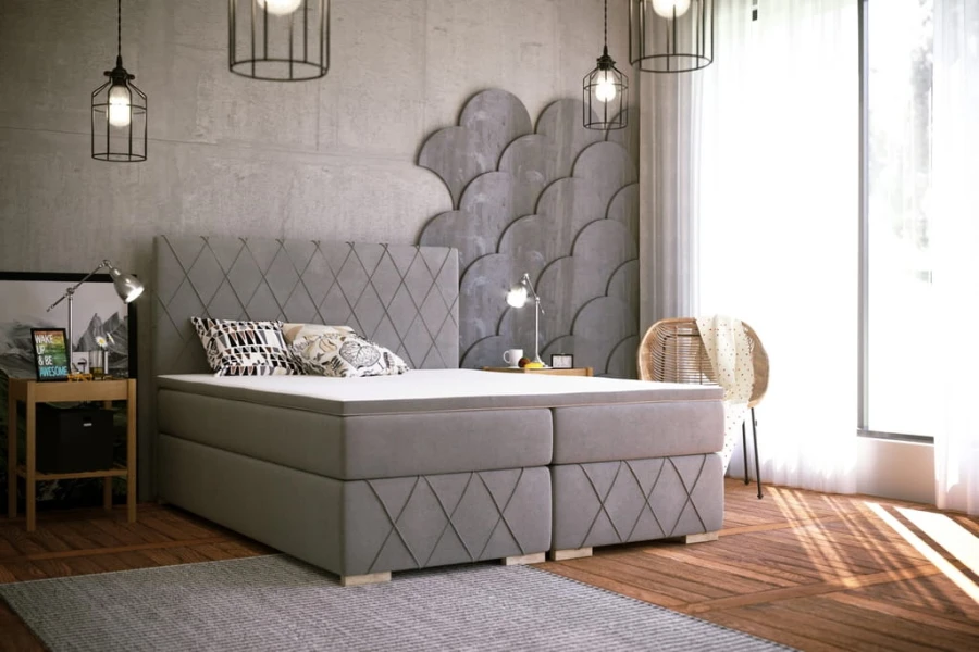 Hellgraues Boxspringbett mit Rautenmuster am Kopfteil in einem modernen Schlafzimmer.