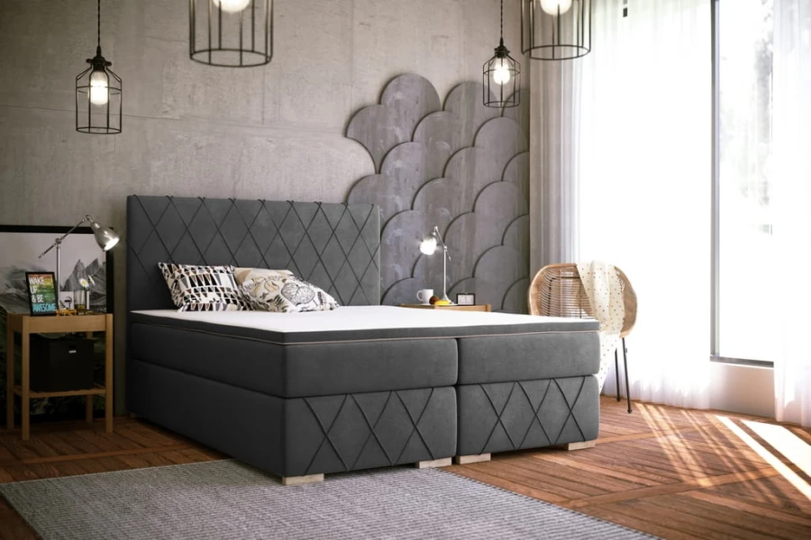 Modernes graues Boxspringbett mit stilvoller Rautensteppung am Kopfteil.