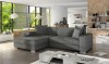 Graues Ecksofa in L-Form in einem modernen, hellen Wohnzimmer mit Ziegelwand-Design.