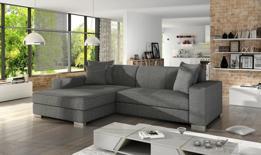Graues Ecksofa in L-Form in einem modernen, hellen Wohnzimmer mit Ziegelwand-Design.