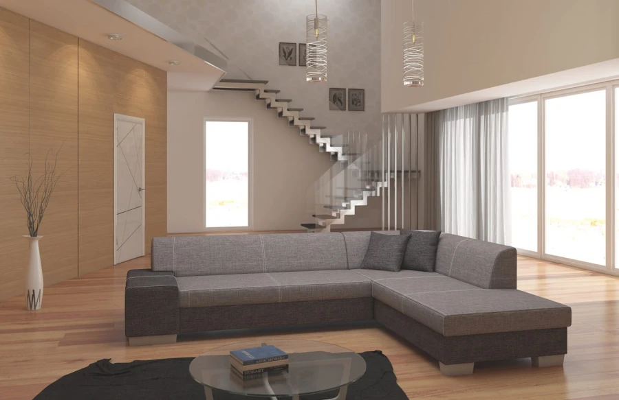 Zweifarbiges Ecksofa in Grau und Dunkelgrau vor einer modernen Treppe im Wohnzimmer.