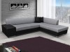 Zweifarbiges Ecksofa in Grau und Schwarz in einem modernen Loft mit Skyline-Aussicht.