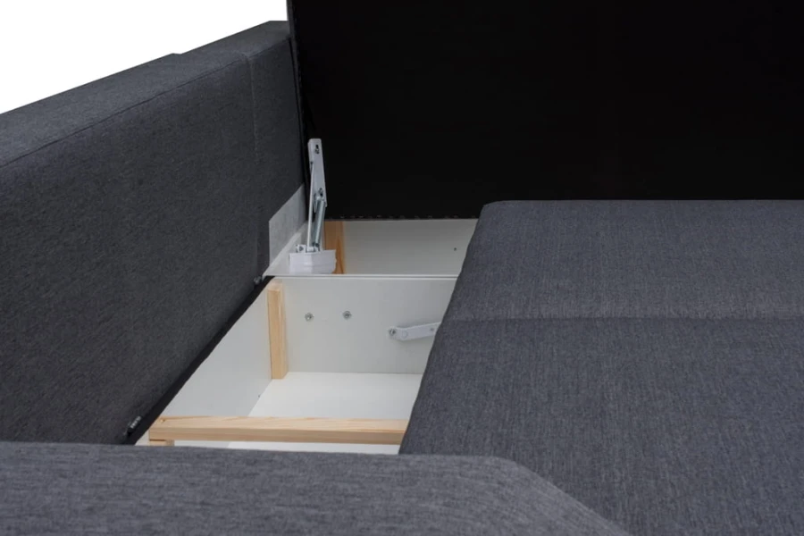 Nahaufnahme eines offenen Bettkastens bei einem grauen Schlafsofa.